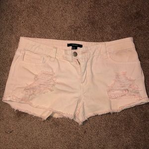 Light pink ripped jean shorts